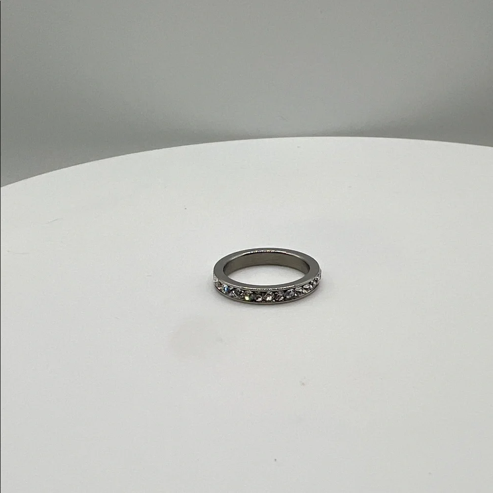555. White Gold Plated Ring‎ Band Over Stainless Steel with Crystal Accents.